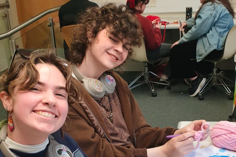 Student Allison and friend sit together in class