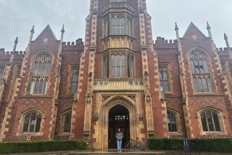 Student Ashmita in front of Lanyon building