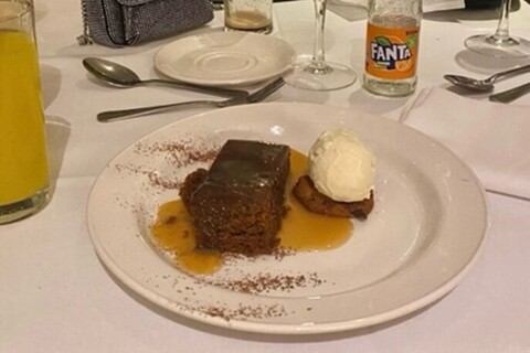 Plate of pudding and ice cream on table