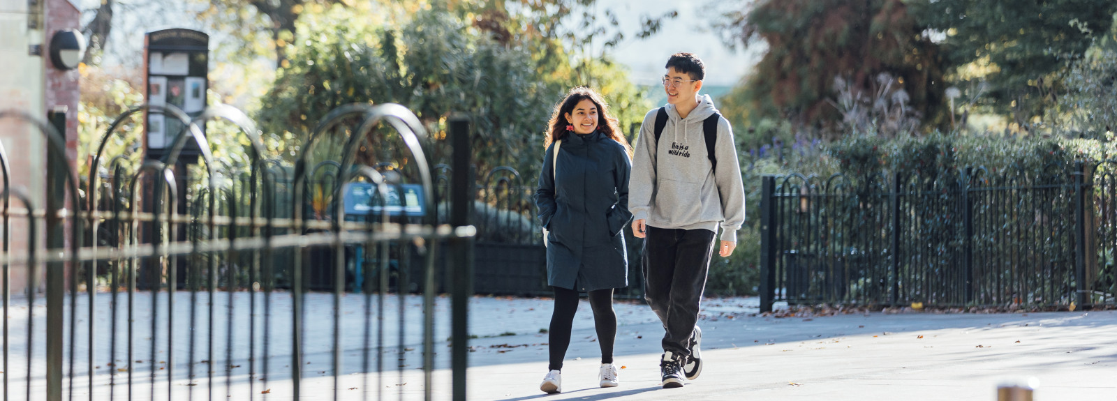 Students Diana and Bryan walking through Botanic Gardens