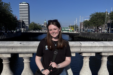Pharmacy student Elle Frith in front of bridge in Belfast