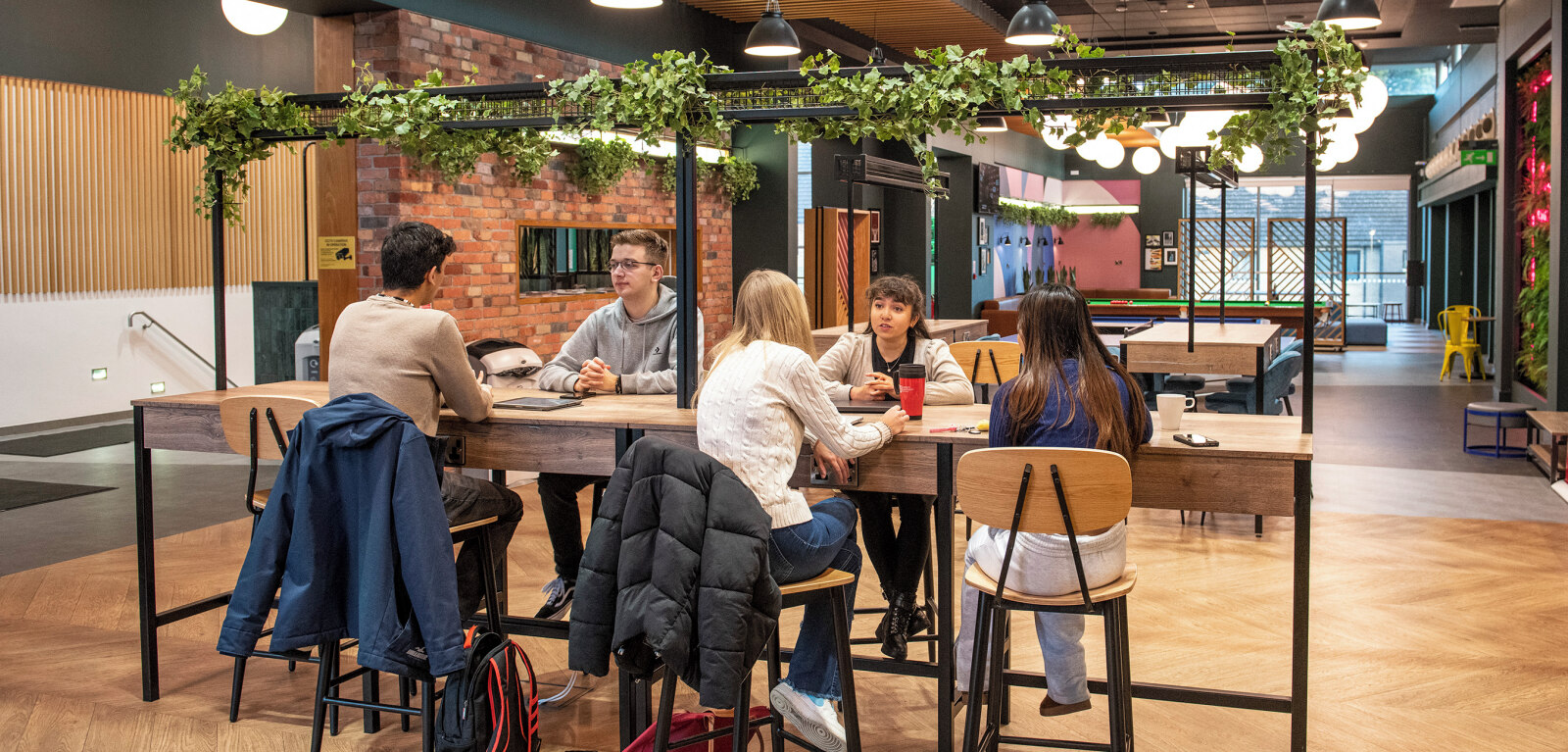 Students sitting together in Elms BT9 Treehouse sitting area