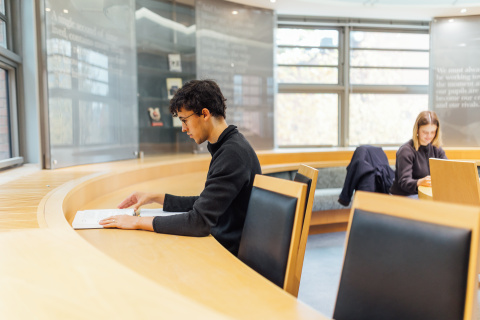 Male student studying in CS Lewis Reading Room