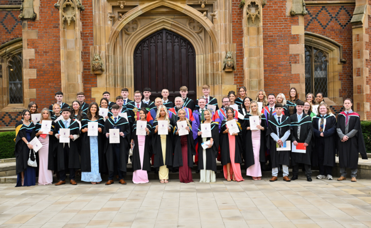 Graduates outside Lanyon Building