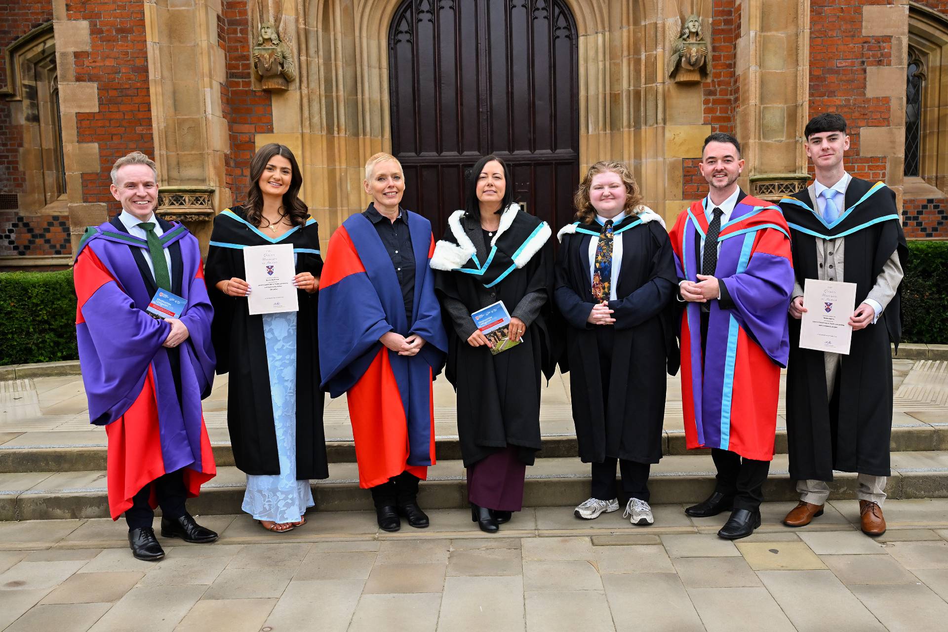 Pictured (L-R) Dr Ryan Feeney, Vice President and Registrar at Queen’s; Emma McAllister, Graduate; Professor Margaret Topping, Pro-Vice Chancellor (Global Engagement) at Queen's; Sarajane Waite, Director, RCITY; Zara Meadows, Queen's student, poet and guest speaker; Dr Wayne Travers, Chairperson of Foróige; and Aiden Preston, Graduate