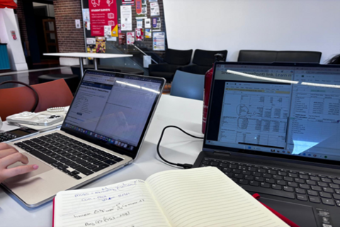 Two laptops on table at lecture