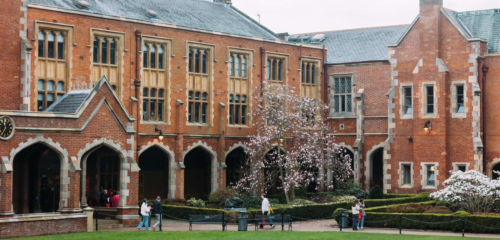 Students walking through QUB quad