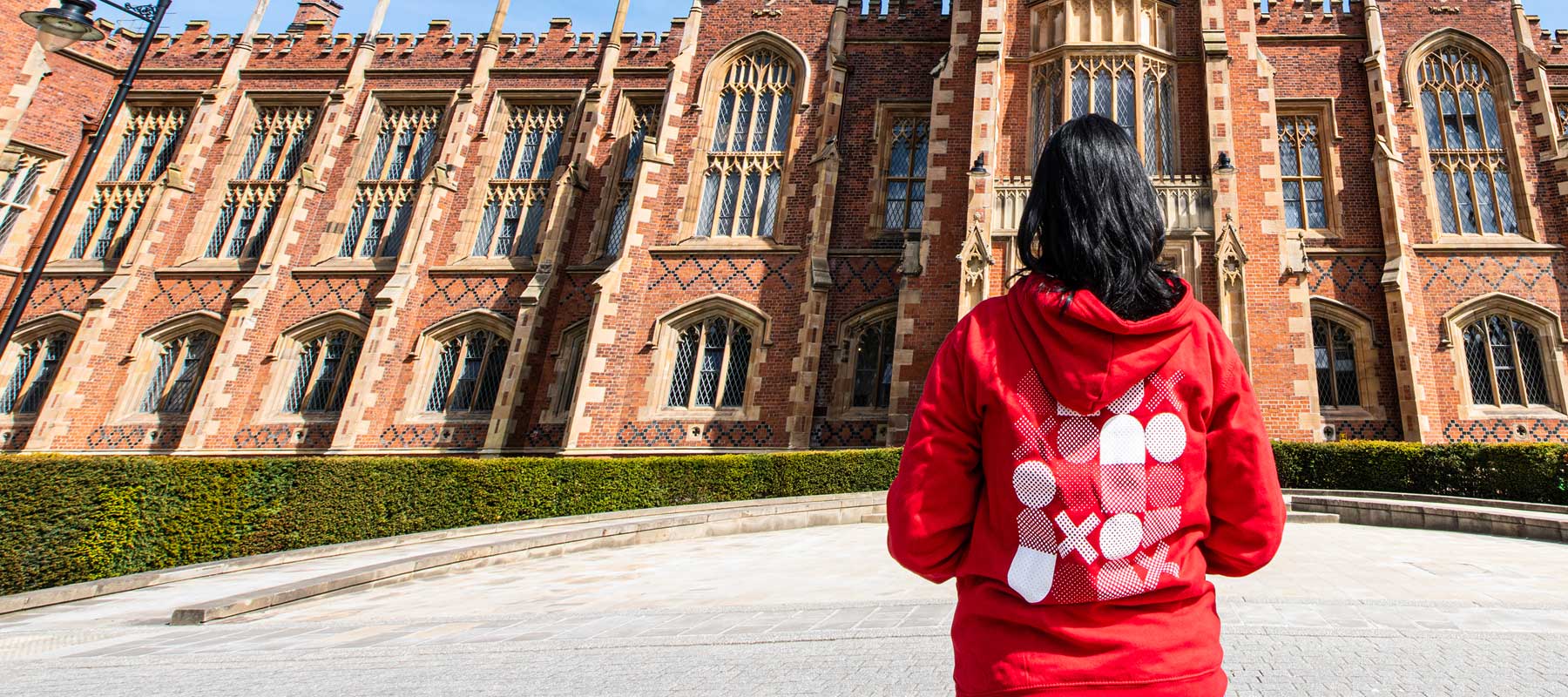Student standing in front of Lanyon Building