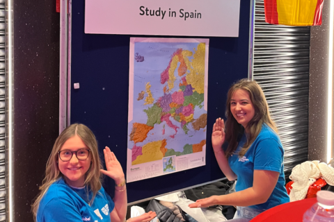 Two students promoting studying in Spain at Freshers Fair
