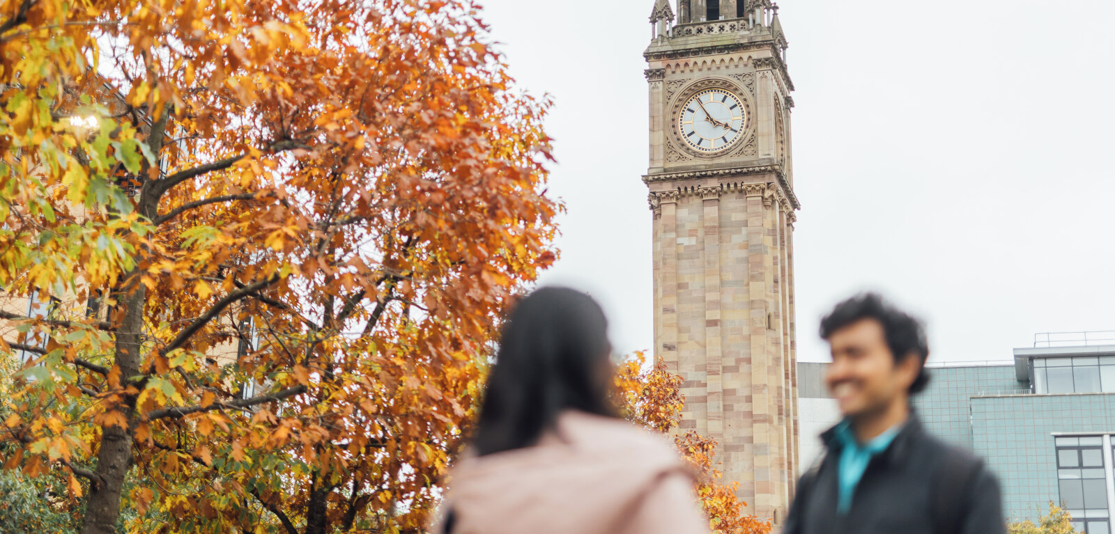 Two students standing in front of Albert Clock