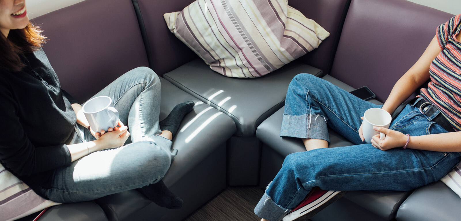 Two students sitting on sofa