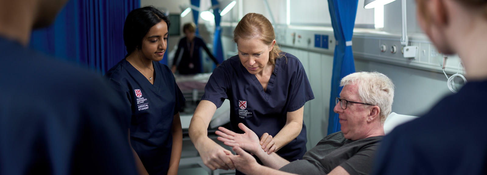 QUB medical students working with a simulated participant